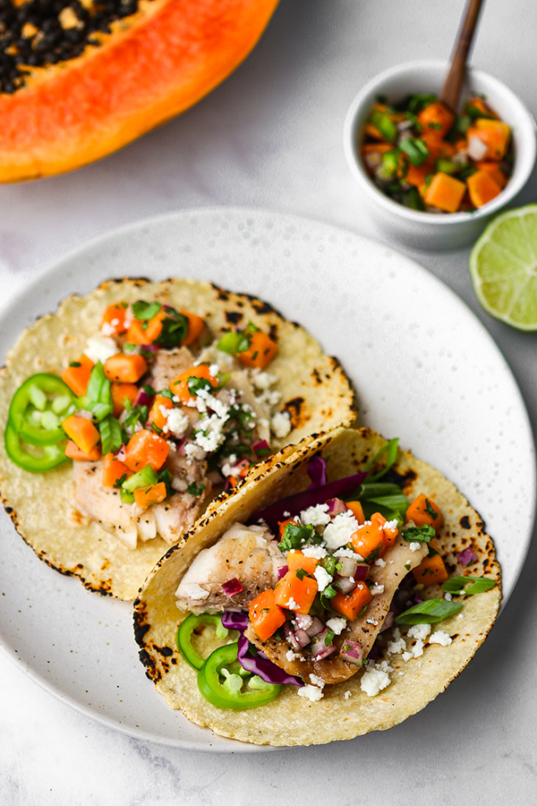 two tacos laid out on a plate